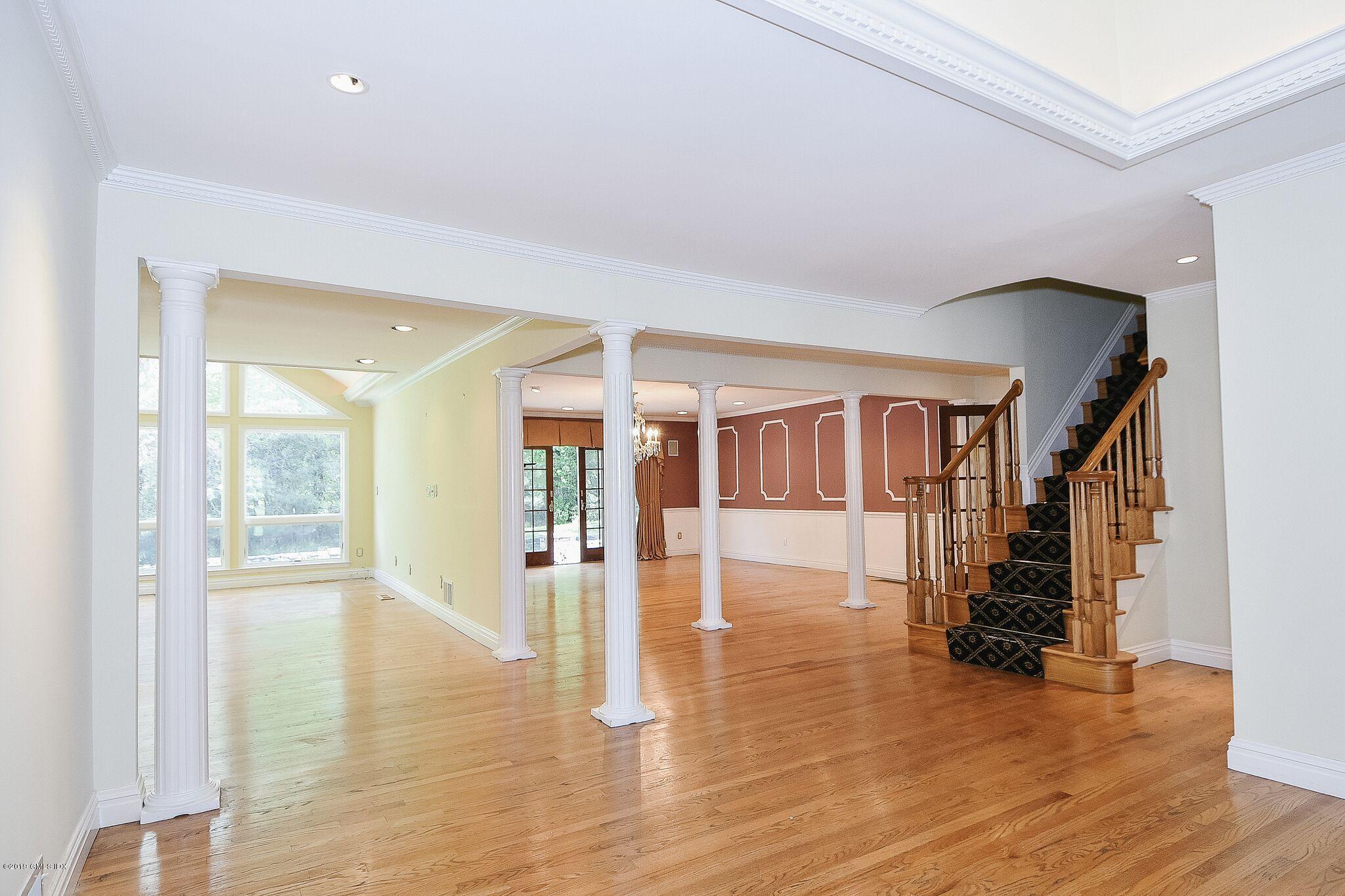 1 Tinker Lane Greenwich, CT 06830 - Photo 4 of 30 a view of empty room with wooden floor