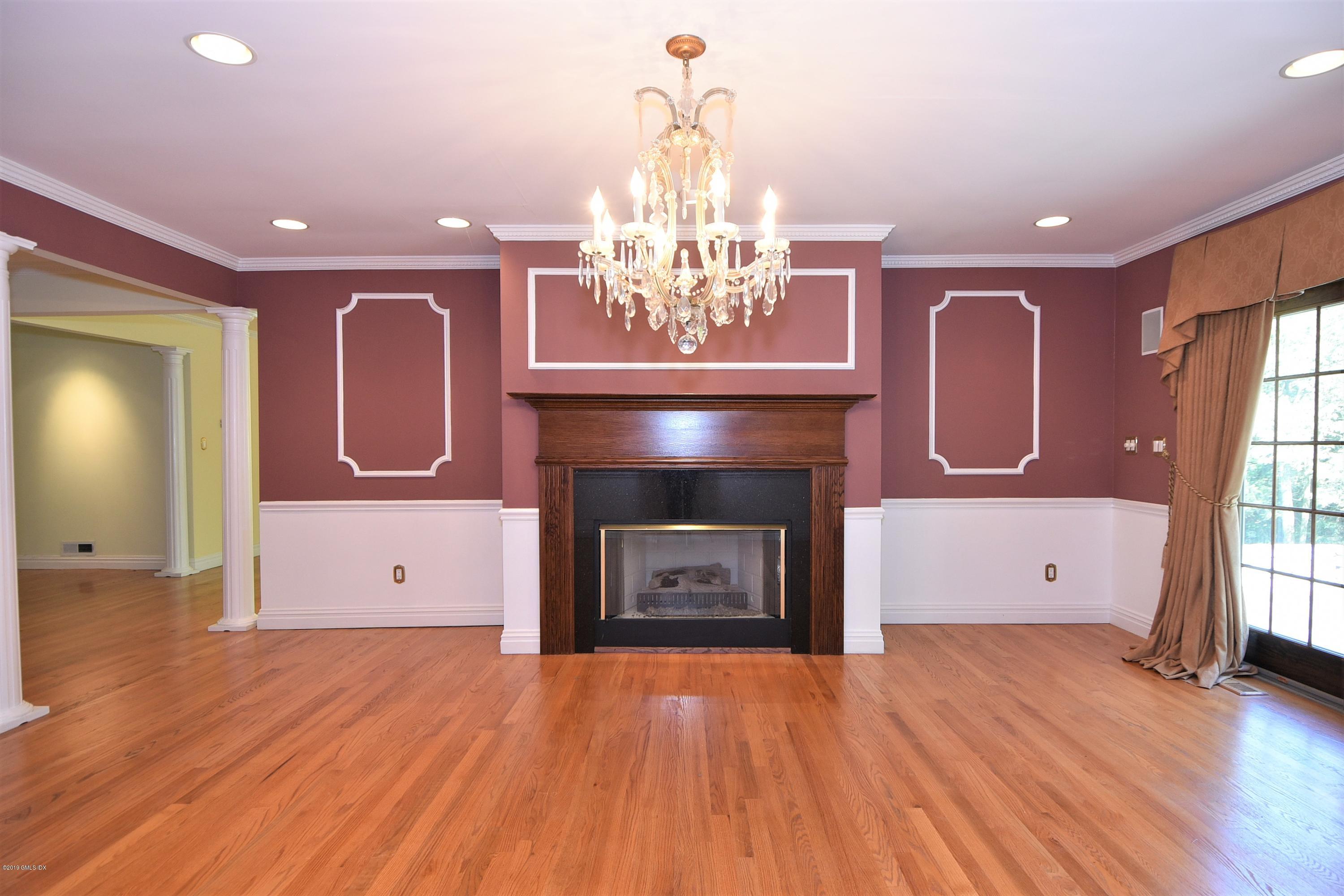 1 Tinker Lane Greenwich, CT 06830 - Photo 10 of 30 a view of kitchen and dining room with wooden floor