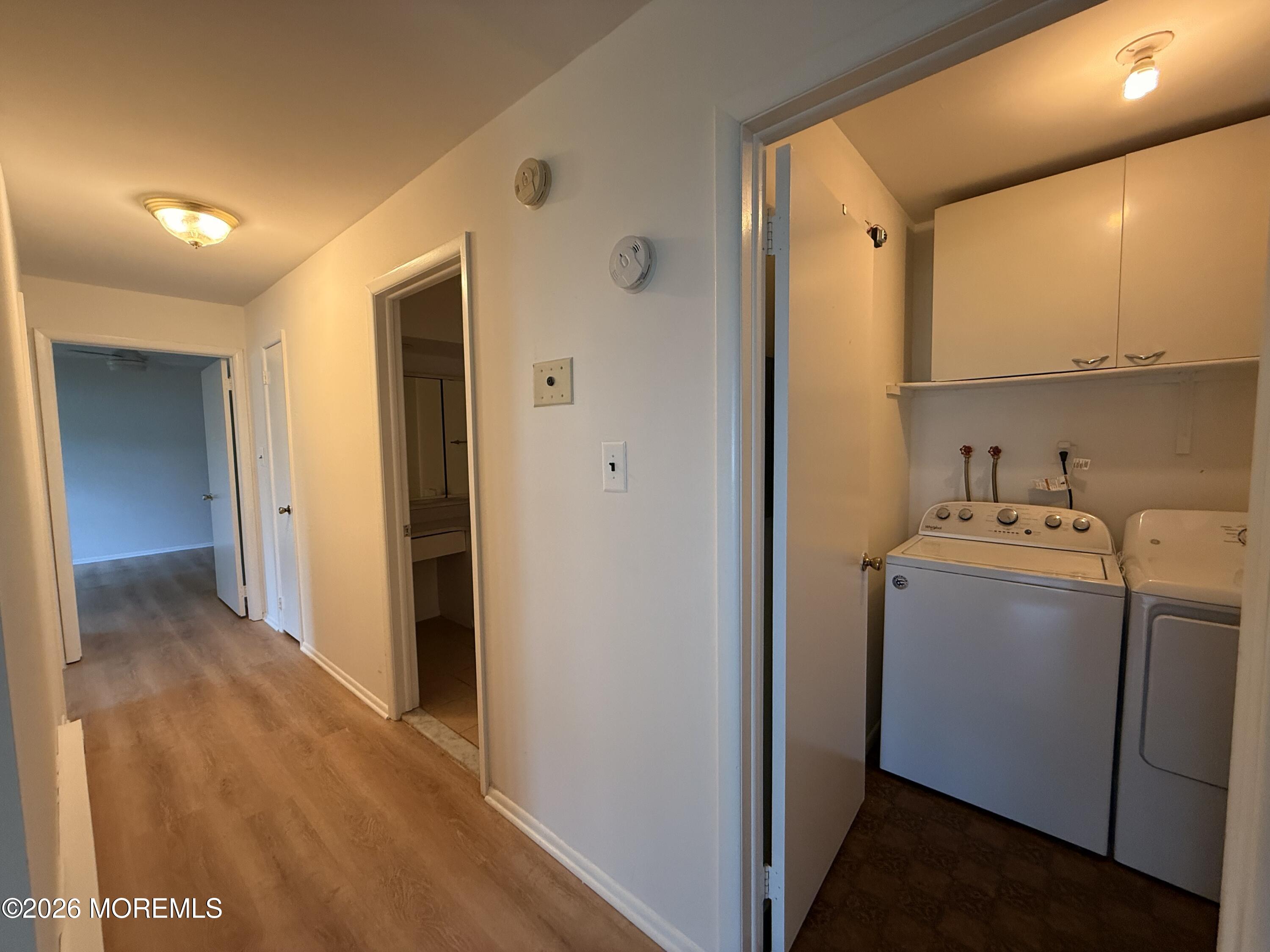 79 Overlook Way, Unit D Manalapan, NJ 07726 - Photo 13 of 13 a view of storage and utility room with a washer and dryer