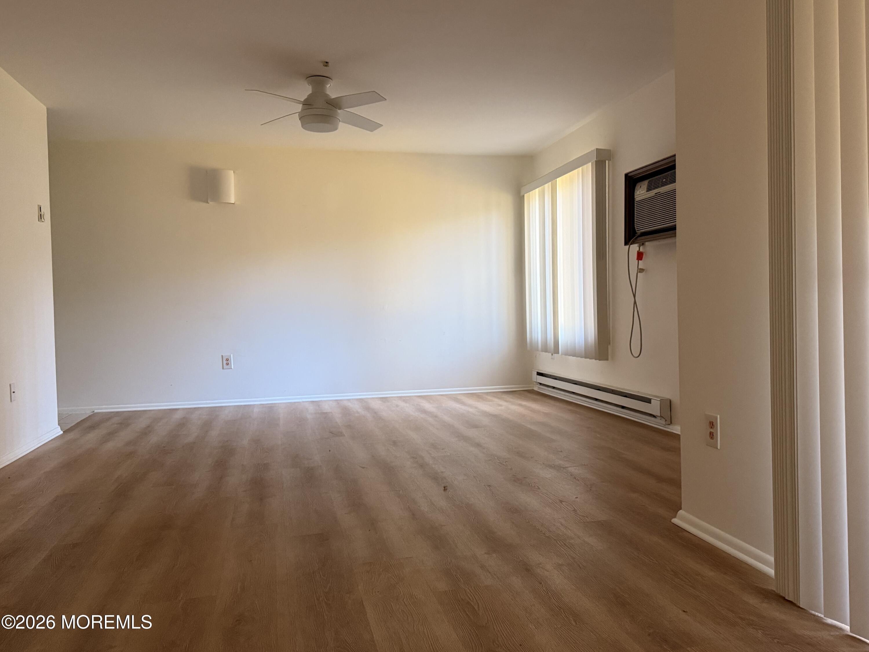 79 Overlook Way, Unit D Manalapan, NJ 07726 - Photo 4 of 13 an empty room with windows