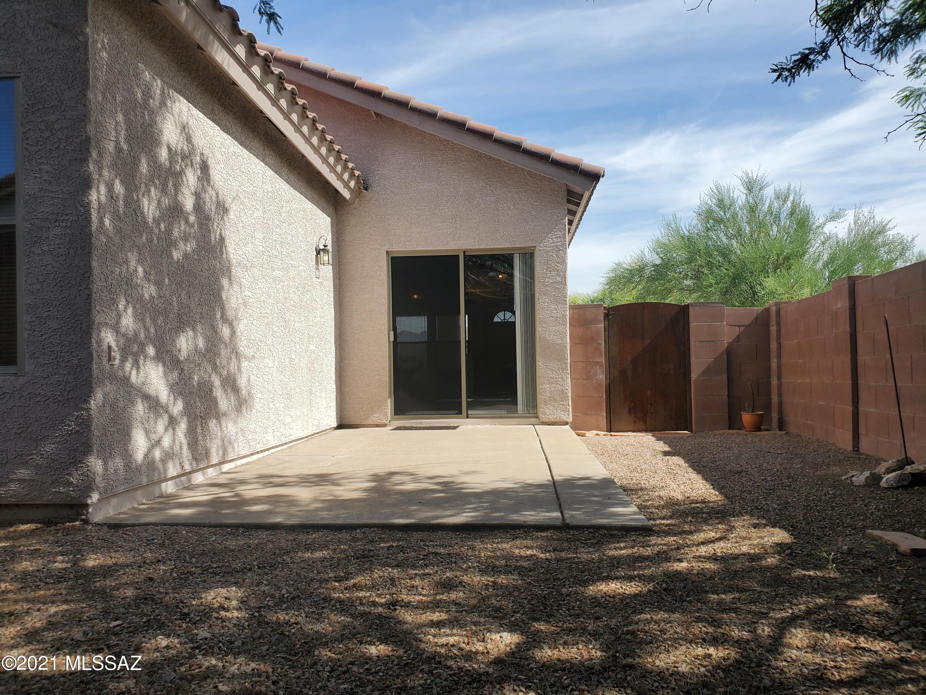 3455 North Boyce Spring Lane Tucson, AZ 85745 - Photo 20 of 21 a house with yard in front of it