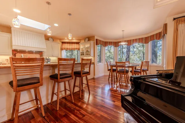 a view of a dining room with furniture window and outside view