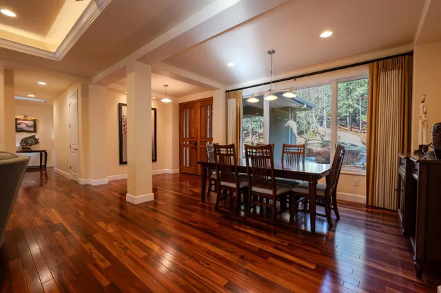 a view of a dining room with furniture window and wooden floor