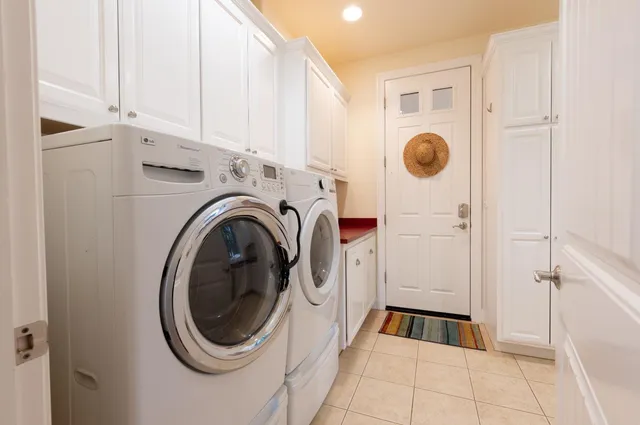 a living room with furniture and large windows
