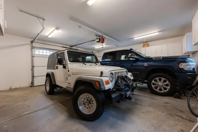 a view of a patio with a table chairs and a umbrella