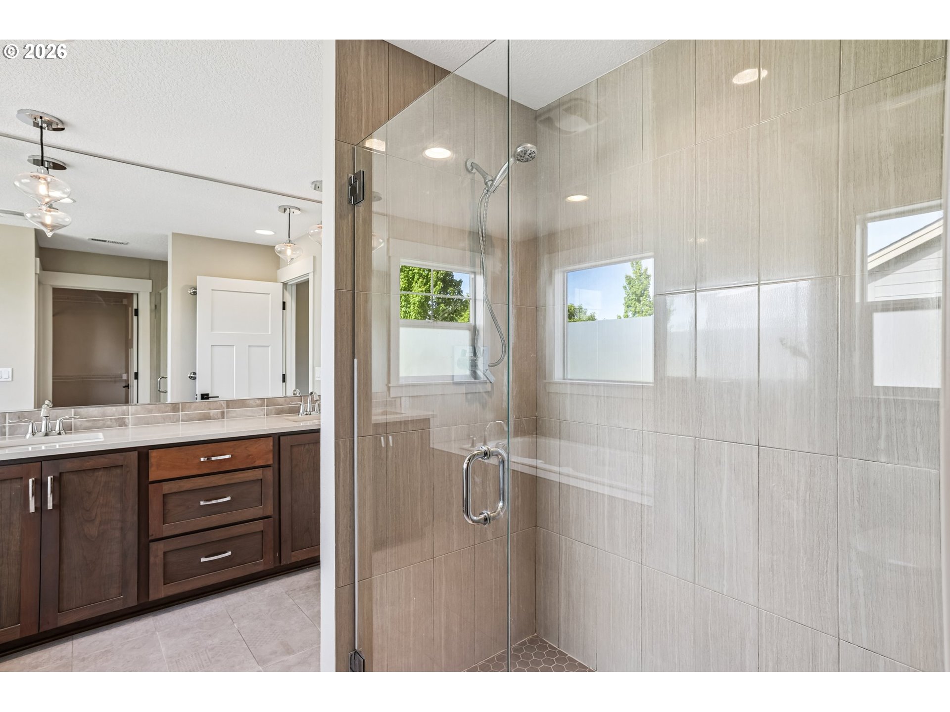 38320 Sequoia Street Sandy, OR 97055 - Photo 22 of 33 a bathroom with a double vanity sink and mirror with shower