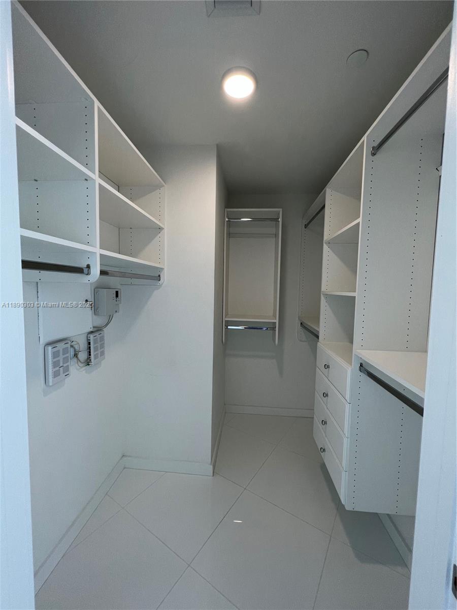 851 Northeast 1st Avenue, Unit 2702 Miami, FL 33132 - Photo 11 of 48 a view of walk in closet