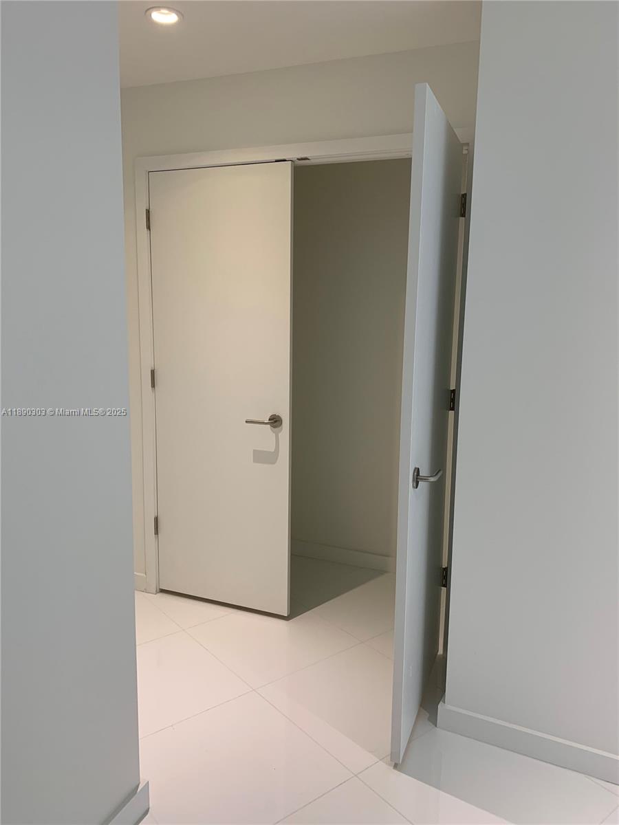 851 Northeast 1st Avenue, Unit 2702 Miami, FL 33132 - Photo 12 of 48 a bathroom with a shower