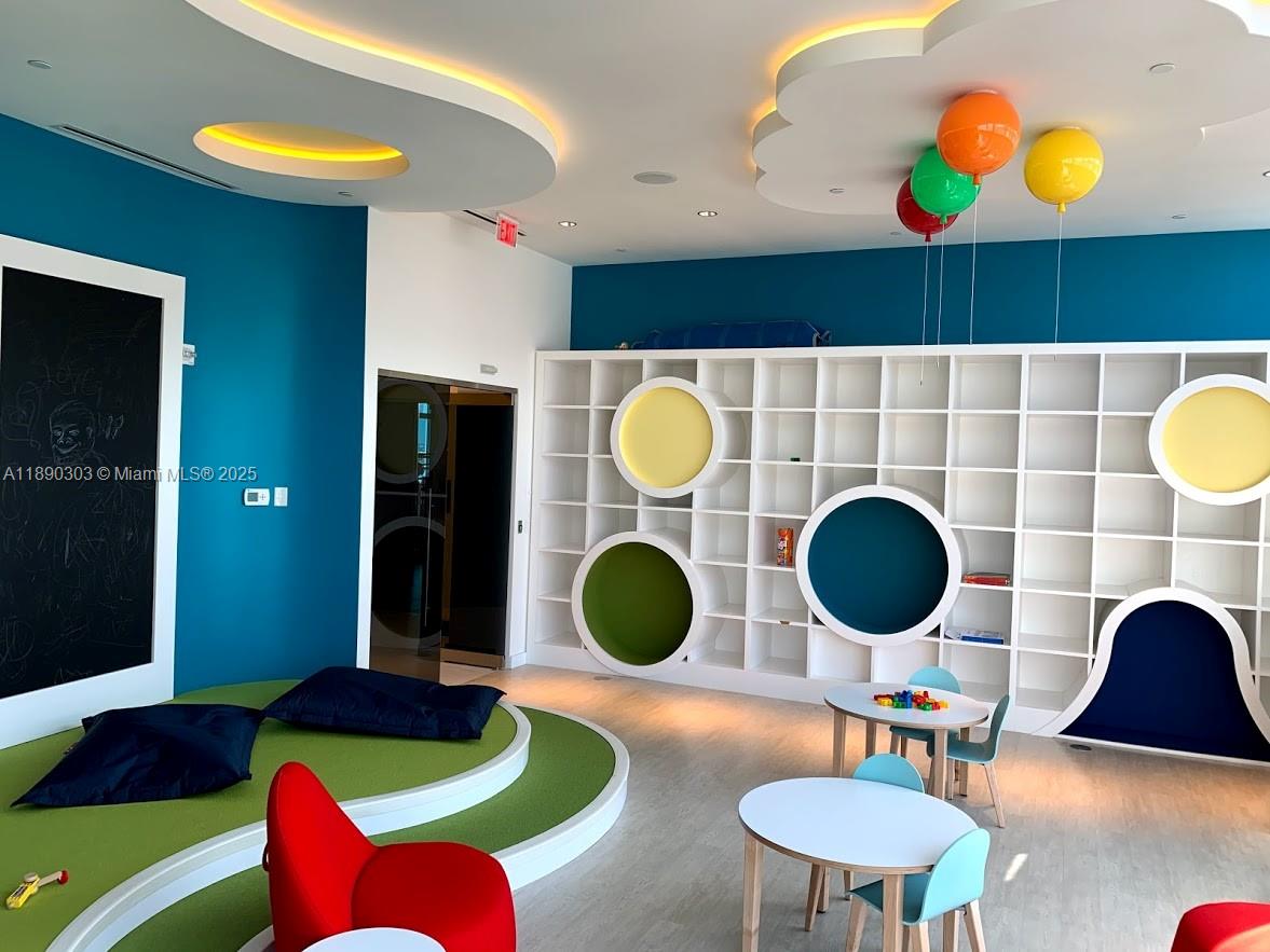 851 Northeast 1st Avenue, Unit 2702 Miami, FL 33132 - Photo 37 of 48 a kitchen with a stove and a wooden floor