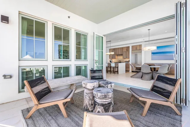a dining room with furniture wooden floor and a rug