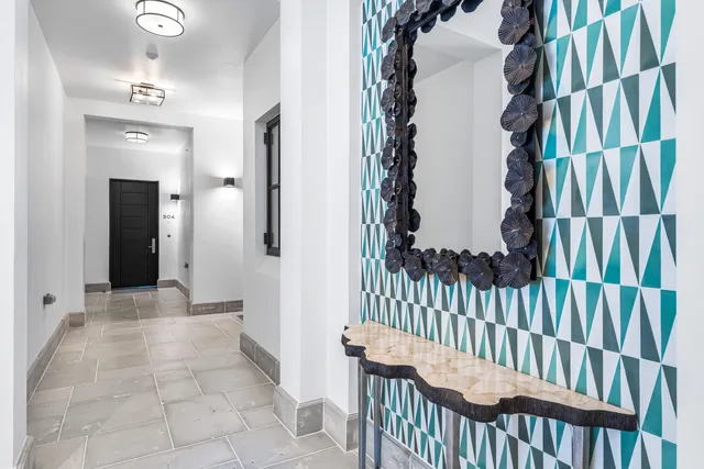 a view of a patio with a table and chairs