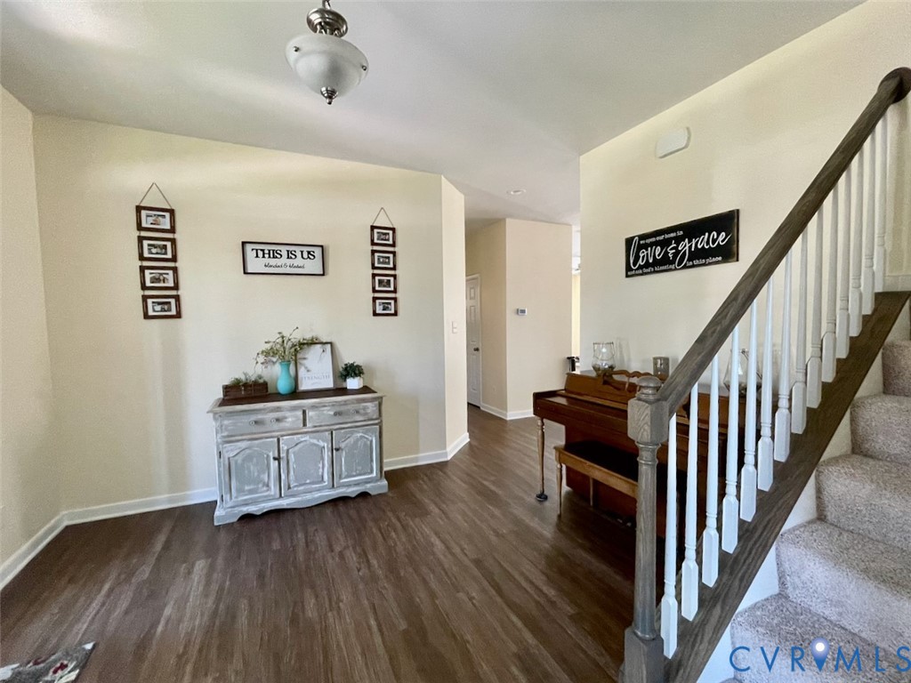 9506 Simonsville Road Midlothian, VA 23112 - Photo 4 of 27 a living room with furniture and wooden floor