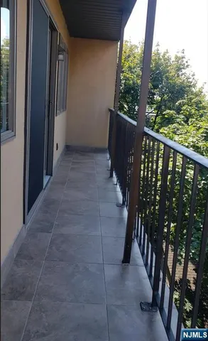 a view of balcony with furniture