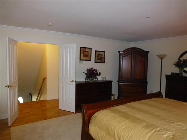 218 Rangeway Road, Unit 274 Billerica, MA 01862 - Photo 15 of 27 a bedroom with a bed and a dresser