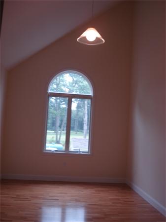218 Rangeway Road, Unit 274 Billerica, MA 01862 - Photo 22 of 27 an empty room with wooden floor and windows