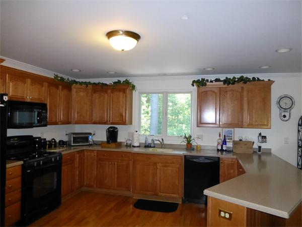 218 Rangeway Road, Unit 274 Billerica, MA 01862 - Photo 5 of 27 a kitchen with a sink stove top oven and cabinets