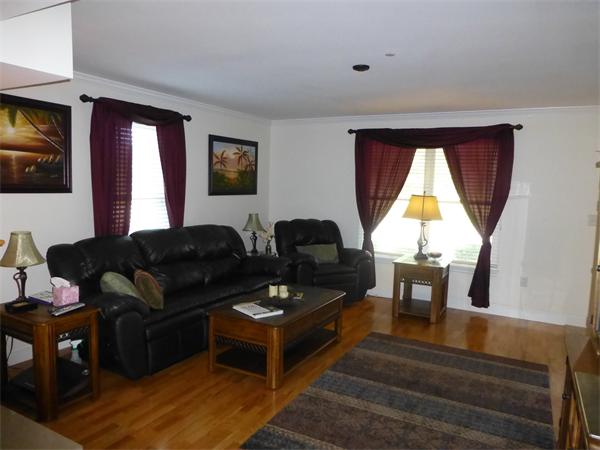 218 Rangeway Road, Unit 274 Billerica, MA 01862 - Photo 7 of 27 a living room with furniture and a flat screen tv