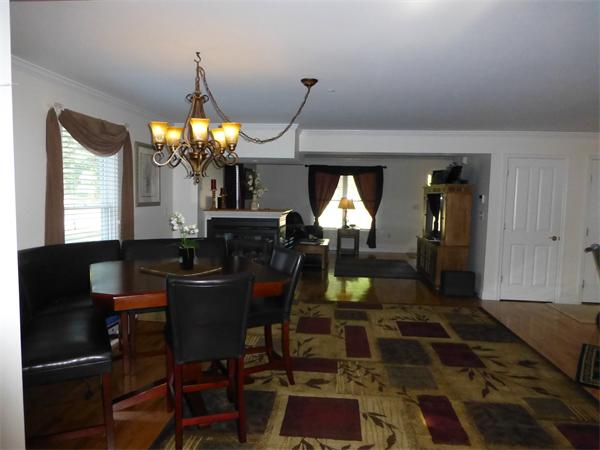 218 Rangeway Road, Unit 274 Billerica, MA 01862 - Photo 8 of 27 a living room with furniture a lamp and a chandelier