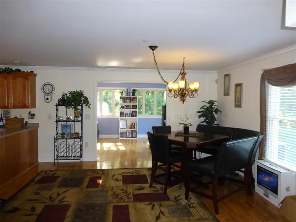 218 Rangeway Road, Unit 274 Billerica, MA 01862 - Photo 9 of 27 a view of a dining room with furniture and a chandelier