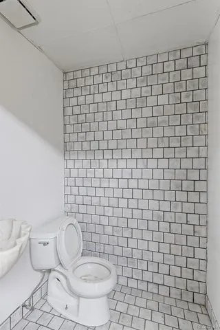 a bathroom with a toilet and a sink