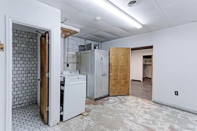 a view of a hallway with closet and entryway