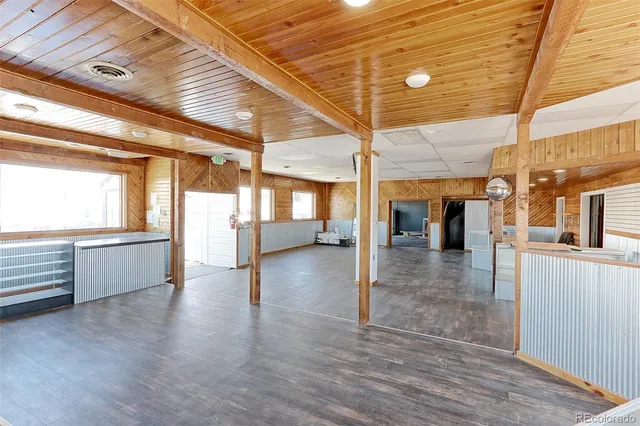 a view of interior space with wooden floor and stairs