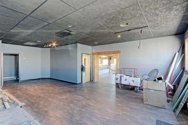 a view of a livingroom with furniture and windows