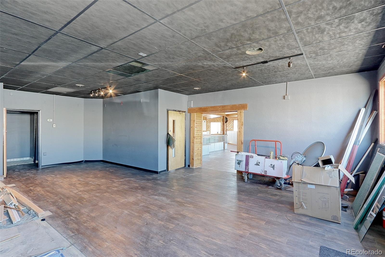 608 Cedar Street Hudson, CO 80642 - Photo 9 of 15 a view of a livingroom with furniture and windows