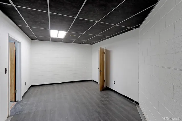 a view of a room with wooden floor and a window