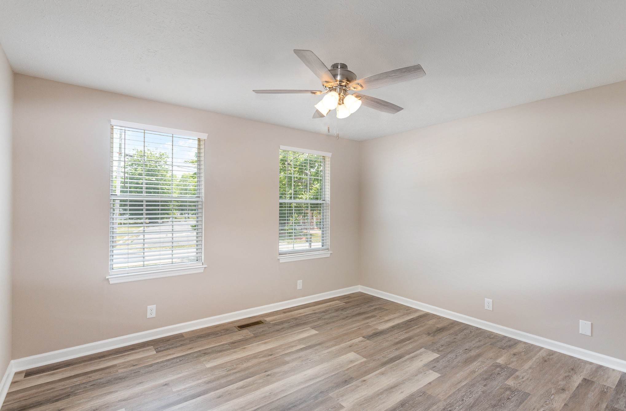 217 Maple Street Madison, TN 37115 - Photo 22 of 44 a view of an empty room with wooden floor and window