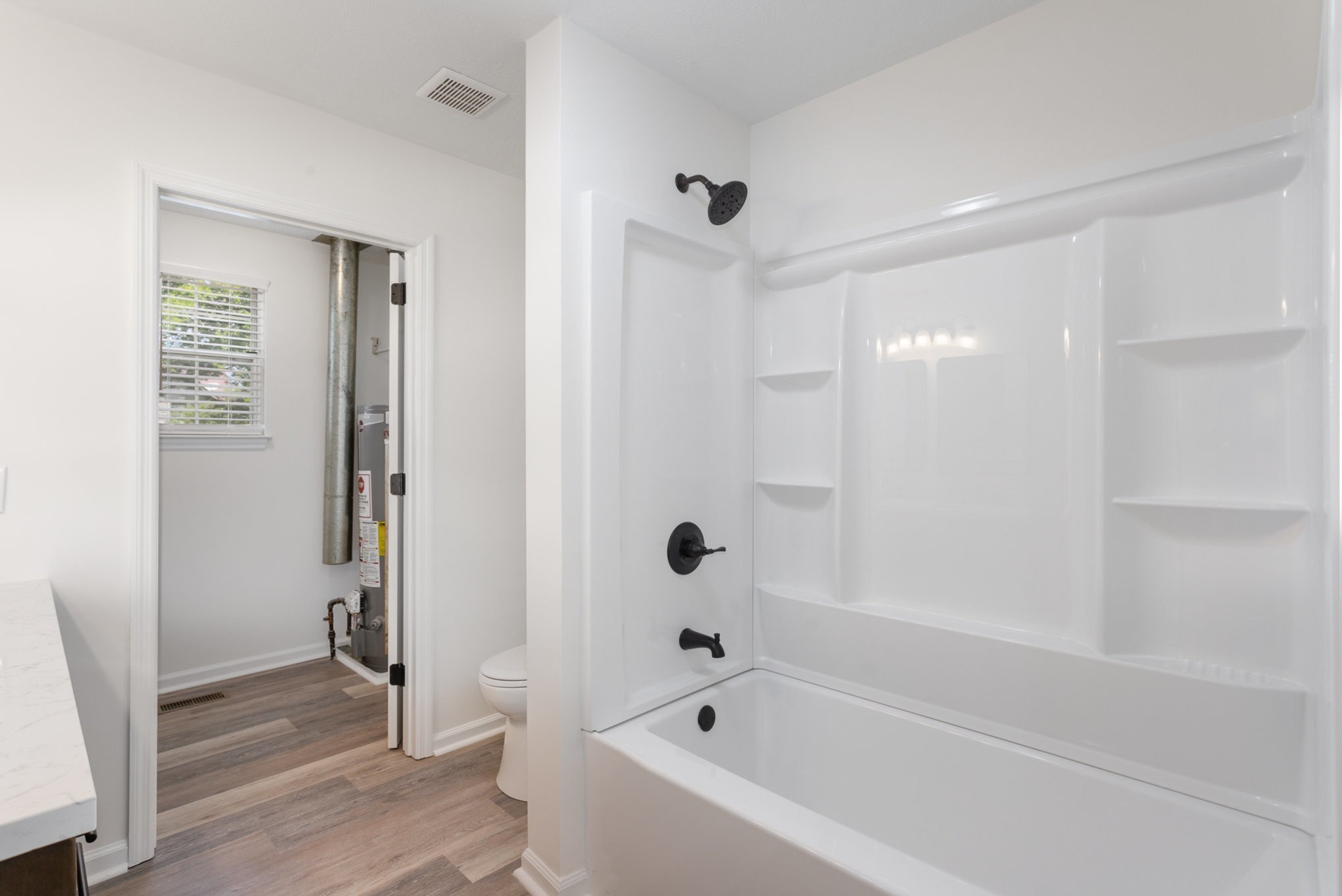 217 Maple Street Madison, TN 37115 - Photo 29 of 44 a bathroom with a bathtub shower and a sink