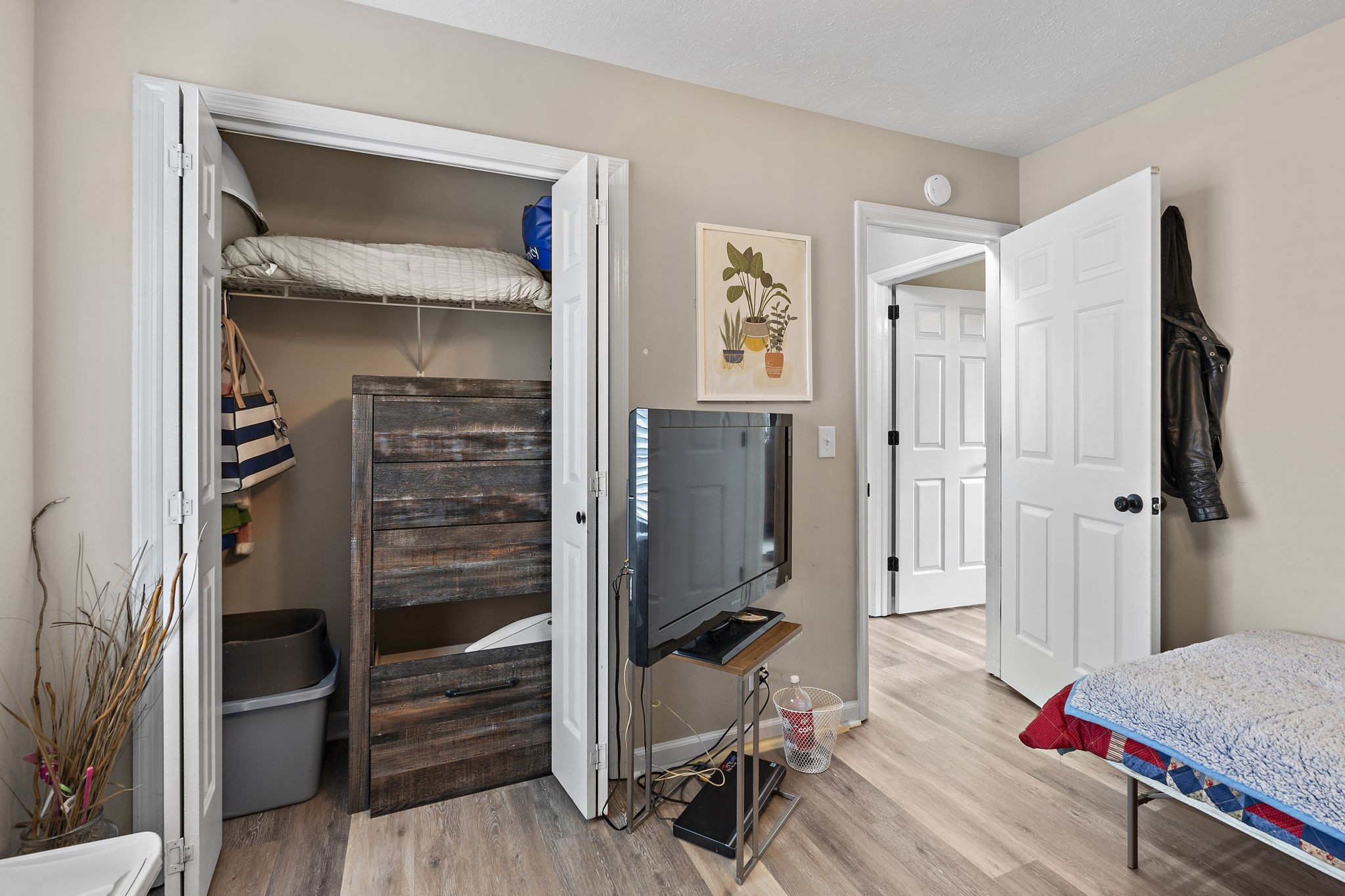 217 Maple Street Madison, TN 37115 - Photo 32 of 44 a bedroom with a bed and a walk in closet