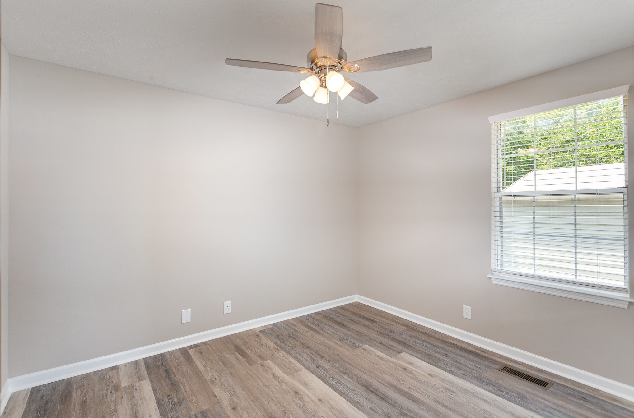 217 Maple Street Madison, TN 37115 - Photo 33 of 44 wooden floor in an empty room with a window