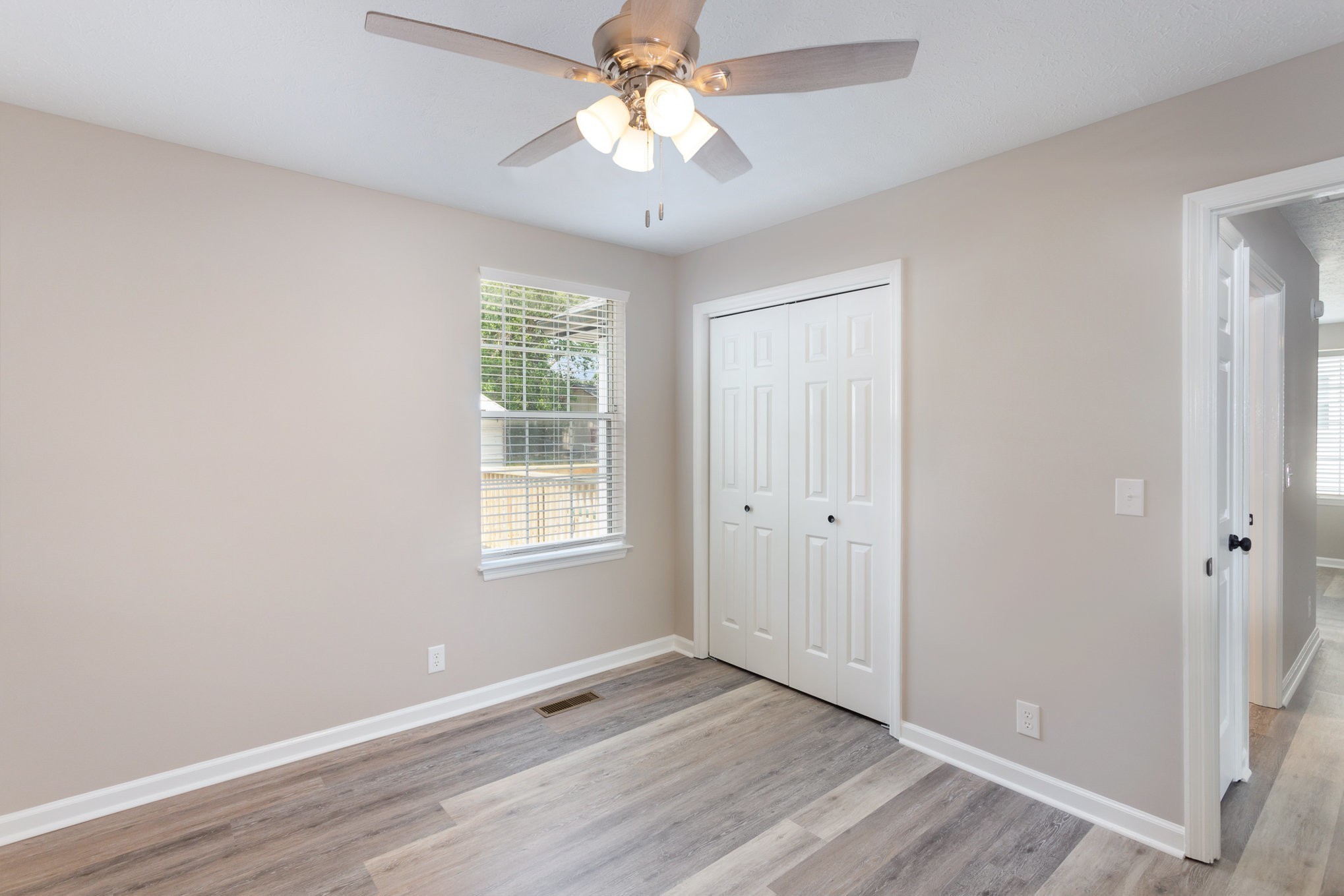 217 Maple Street Madison, TN 37115 - Photo 35 of 44 a view of an empty room with a window and wooden floor