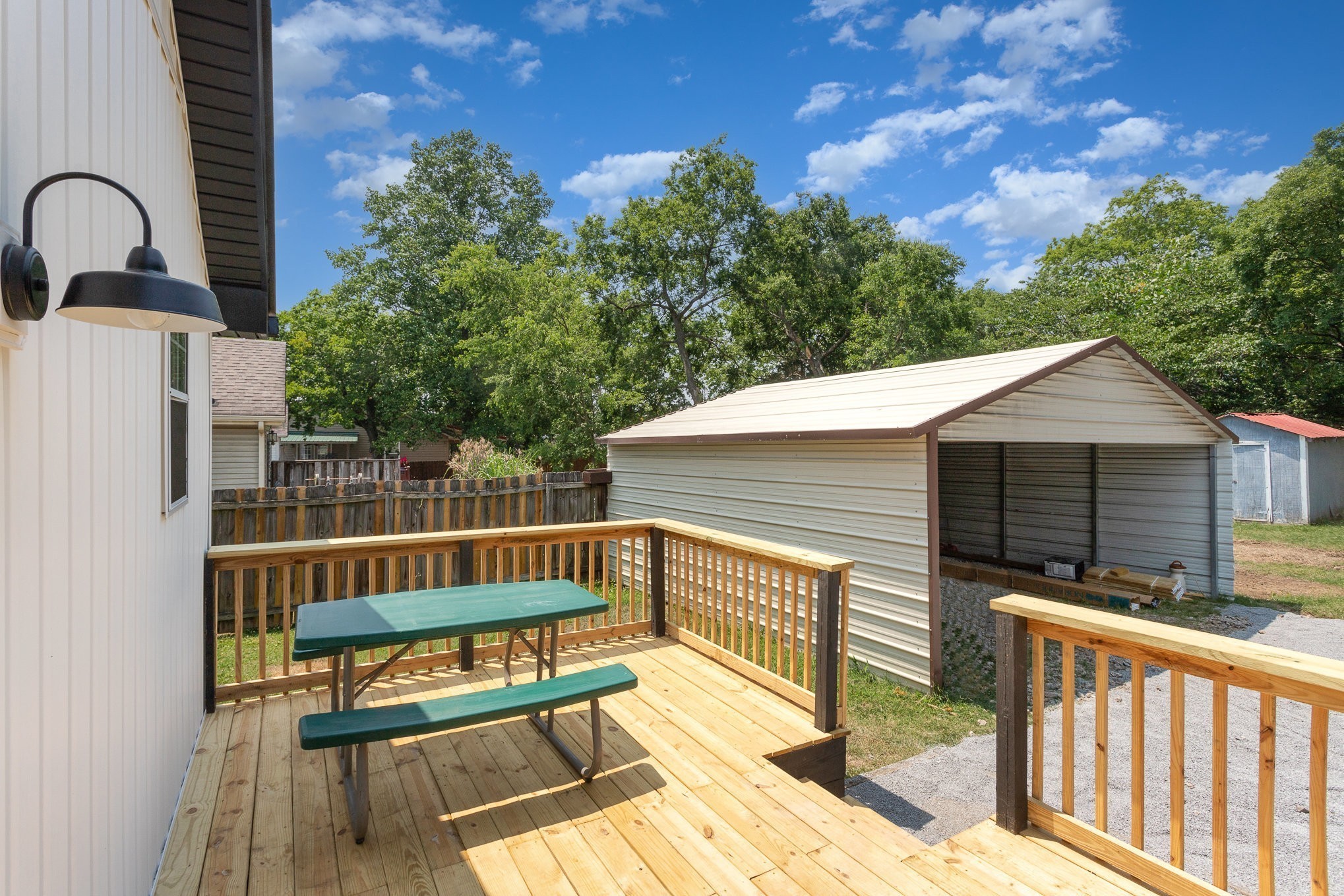 217 Maple Street Madison, TN 37115 - Photo 40 of 44 a view of a wooden deck and a backyard
