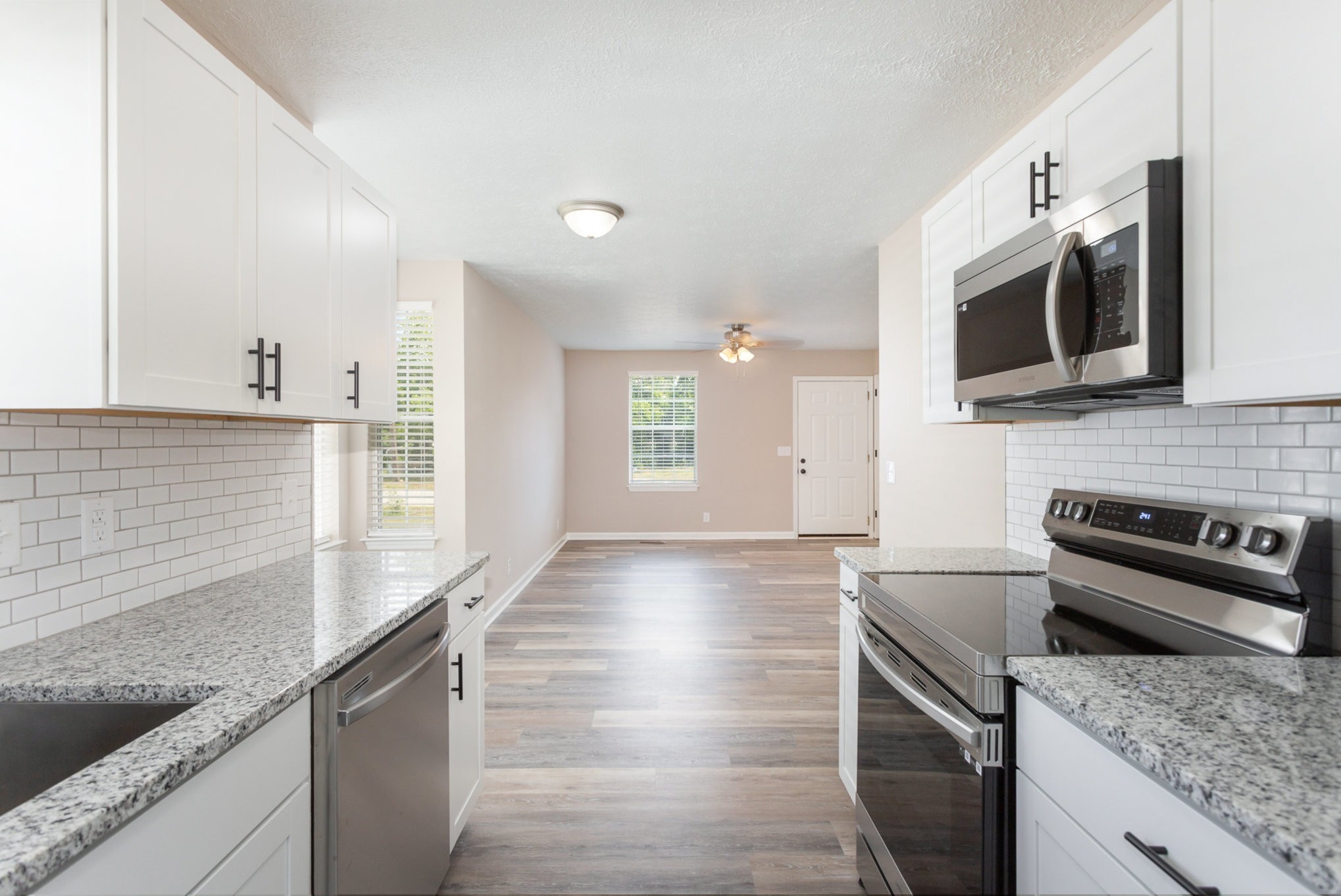 217 Maple Street Madison, TN 37115 - Photo 5 of 44 a kitchen with stainless steel appliances granite countertop a sink and a stove