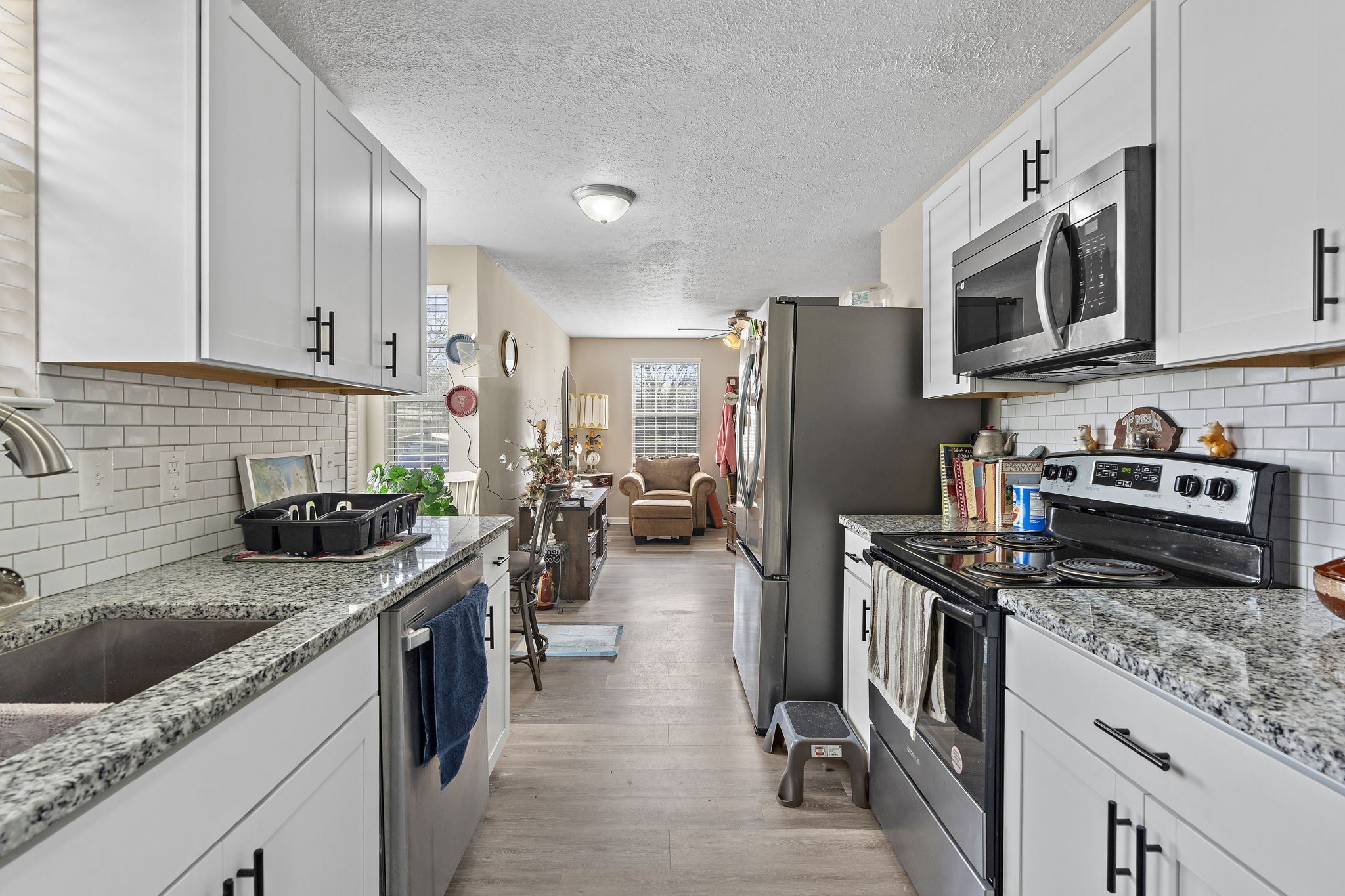 217 Maple Street Madison, TN 37115 - Photo 6 of 44 a kitchen with stainless steel appliances granite countertop a stove refrigerator sink and dishwasher