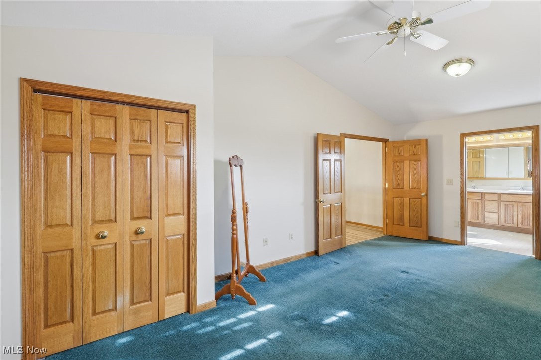 5475 Windfall Road Medina, OH 44256 - Photo 16 of 41 On second floor. Vaulted ceiling, carpet floors, ceiling fan, and ensuite bath
