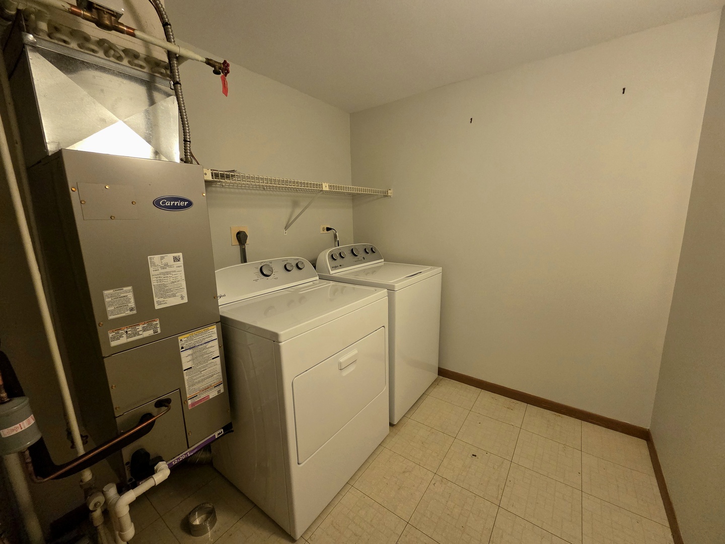511 Aurora Avenue, Unit 108 Naperville, IL 60540 - Photo 17 of 32 a utility room with dryer and washer