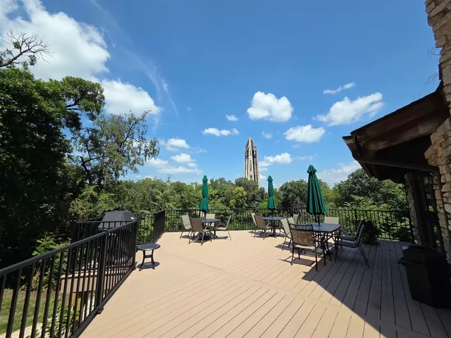 a view of a patio with a table and chairs and potted plants