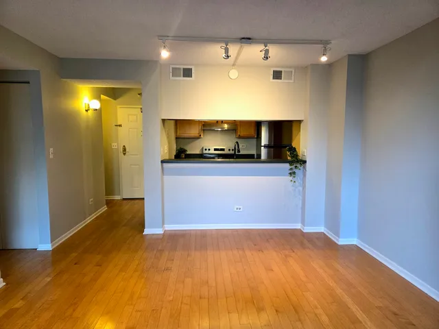 a view of a room with a wooden floor