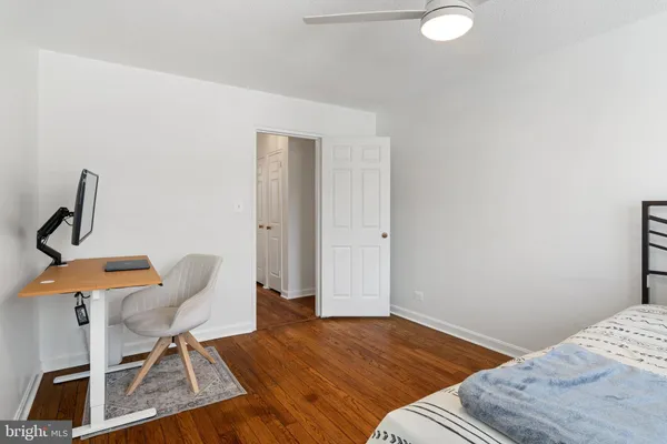 a bedroom with a bed and a chair