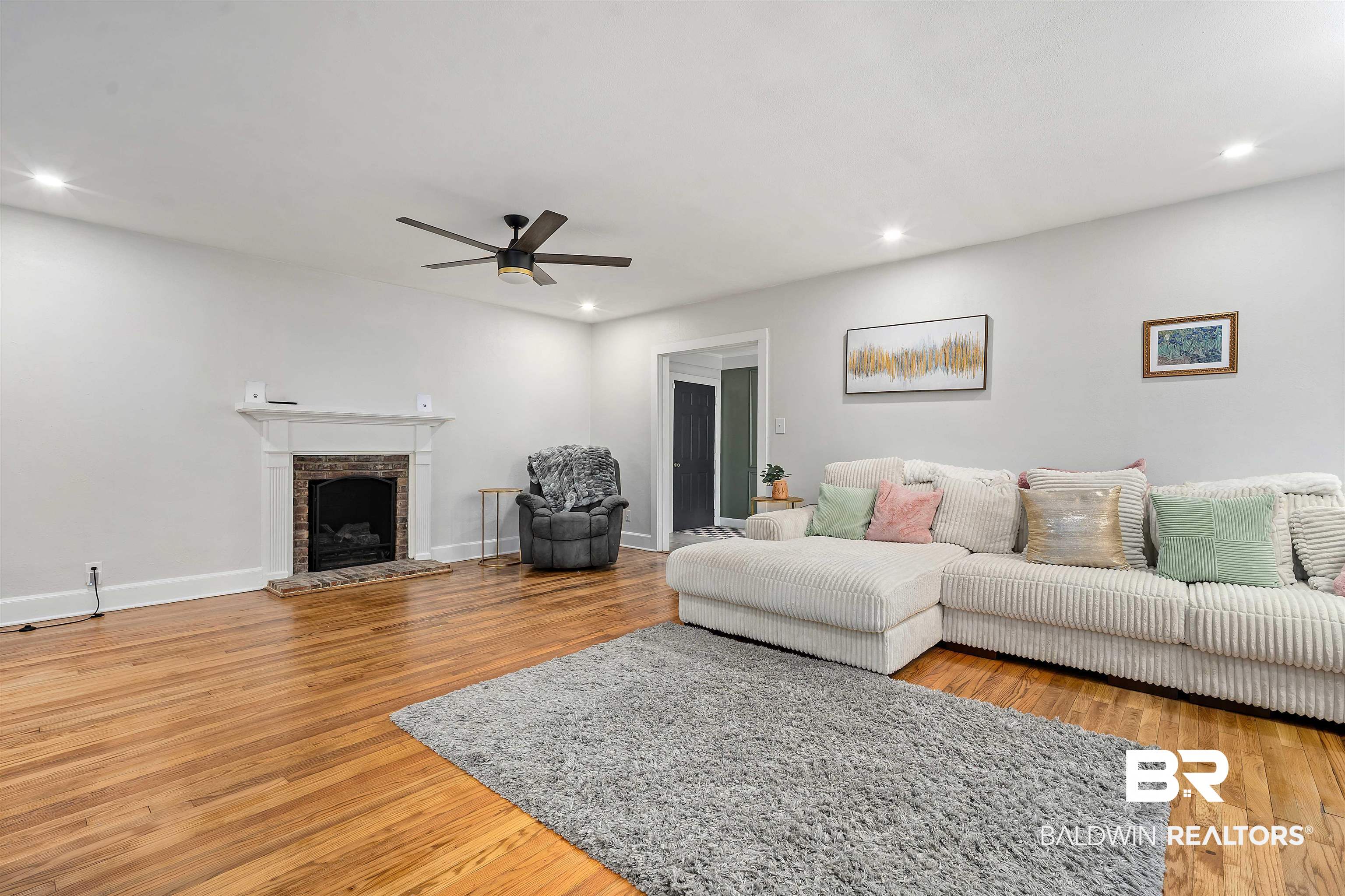 103 Emogene Place Mobile, AL 36606 - Photo 7 of 32 Living room featuring light wood-type flooring, ceiling fan, a fireplace, and recessed lighting