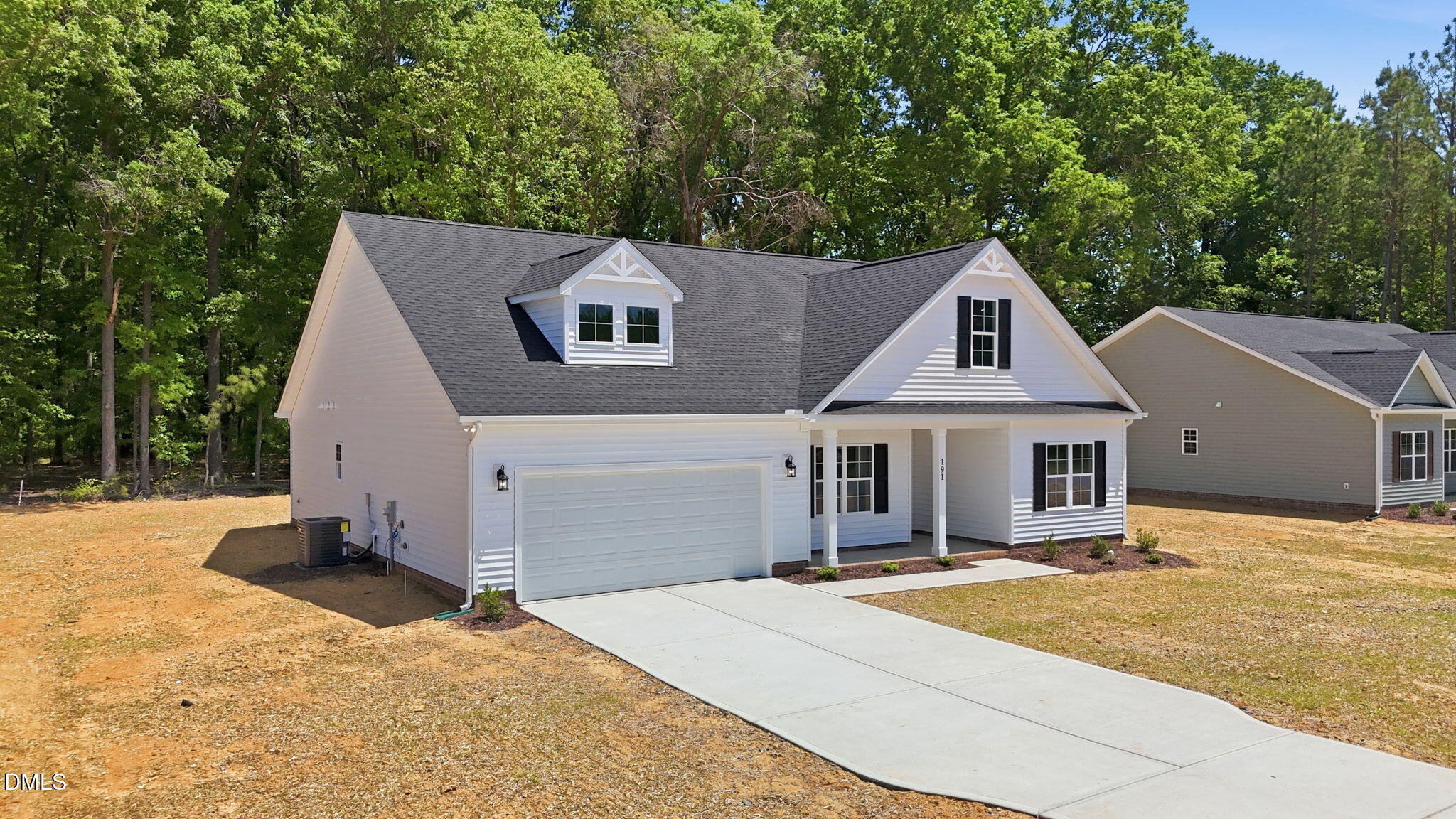 191 Nectar Lane Bunnlevel, NC 28323 - Photo 3 of 35 a front view of a house with a yard and garage