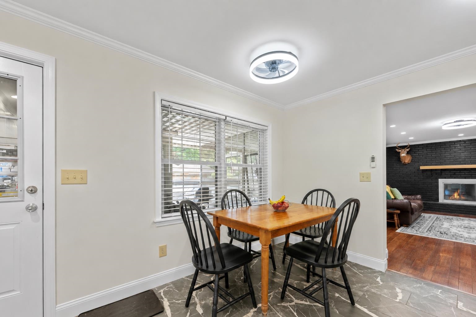 2218 Riverdale Road Germantown, TN 38138 - Photo 10 of 40 Cozy breakfast area overlooking the screened porch, offering the perfect spot for casual meals, morning coffee, or gathering.