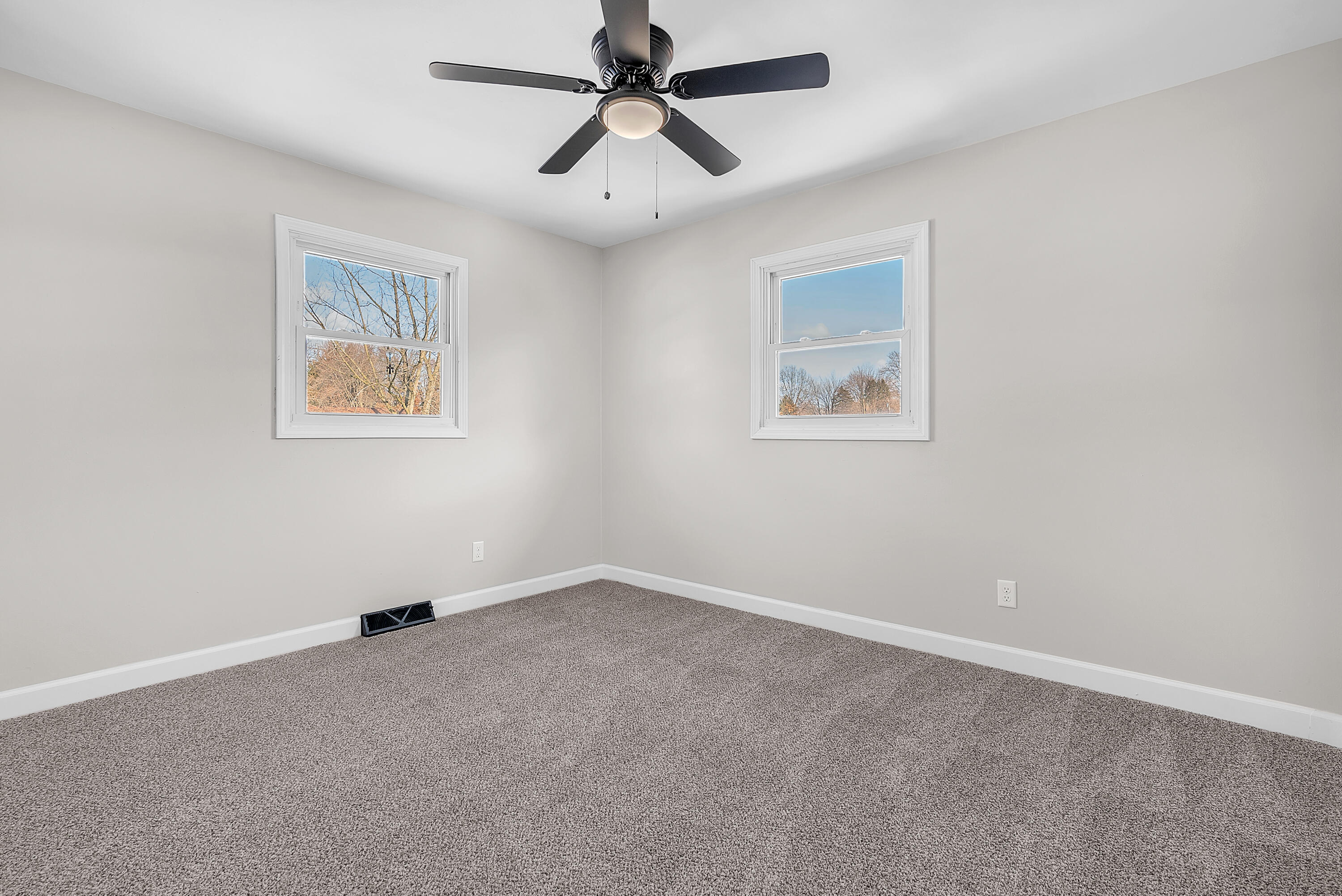 6395 Valleyview Avenue Portage, IN 46368 - Photo 12 of 20 a view of an empty room with a fan