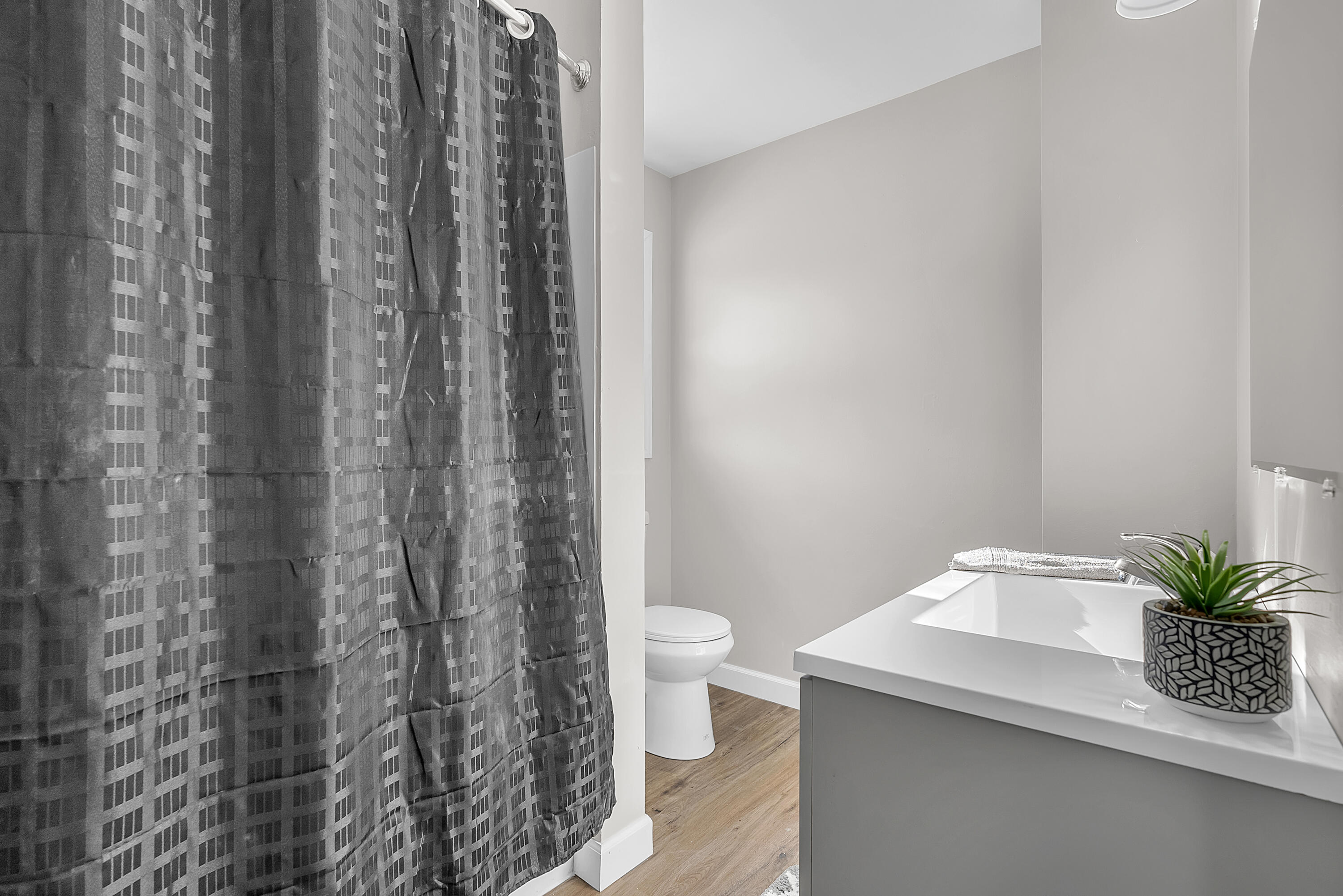 6395 Valleyview Avenue Portage, IN 46368 - Photo 13 of 20 a bathroom with a shower curtain and a toilet