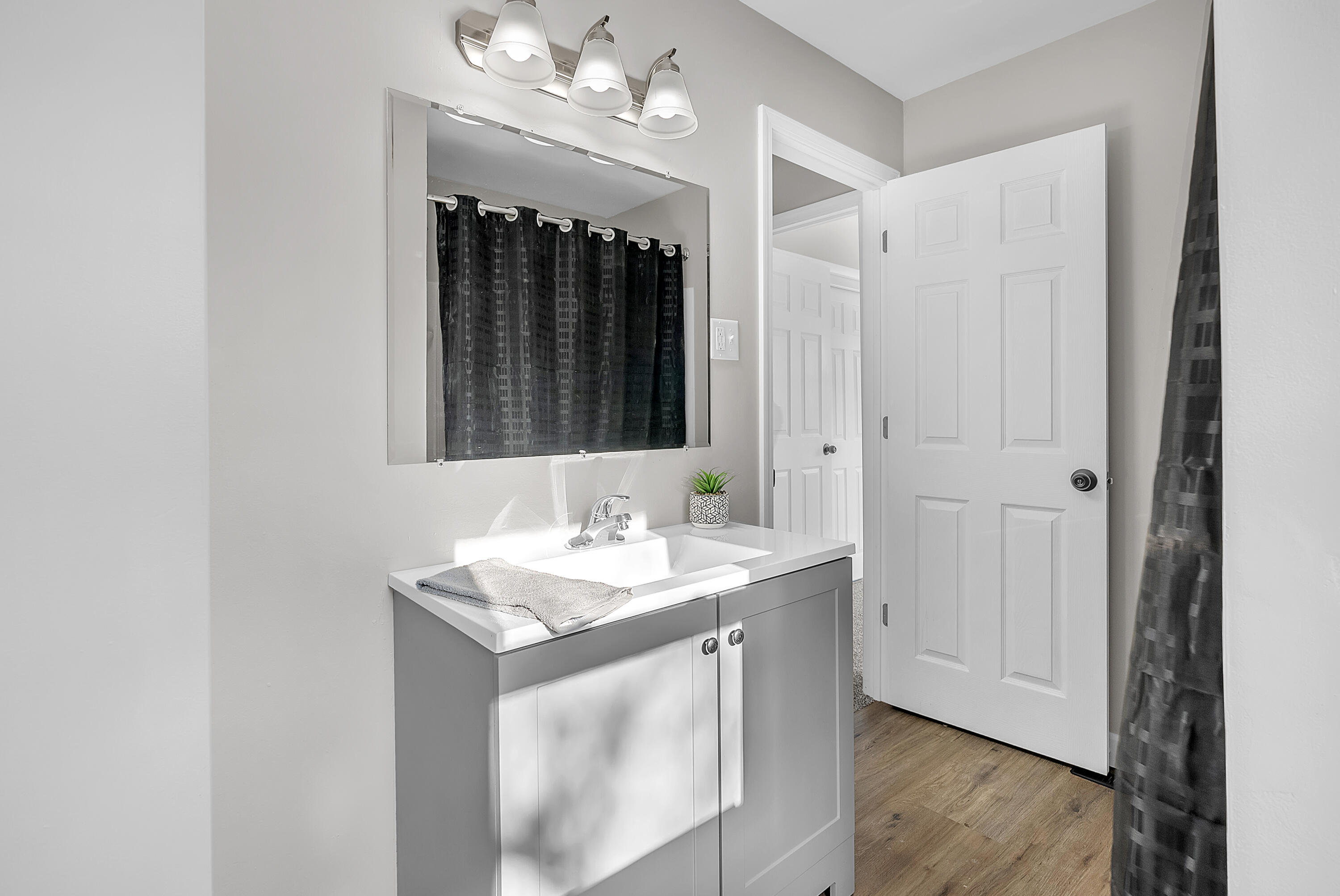 6395 Valleyview Avenue Portage, IN 46368 - Photo 14 of 20 a bathroom with a sink vanity and a mirror