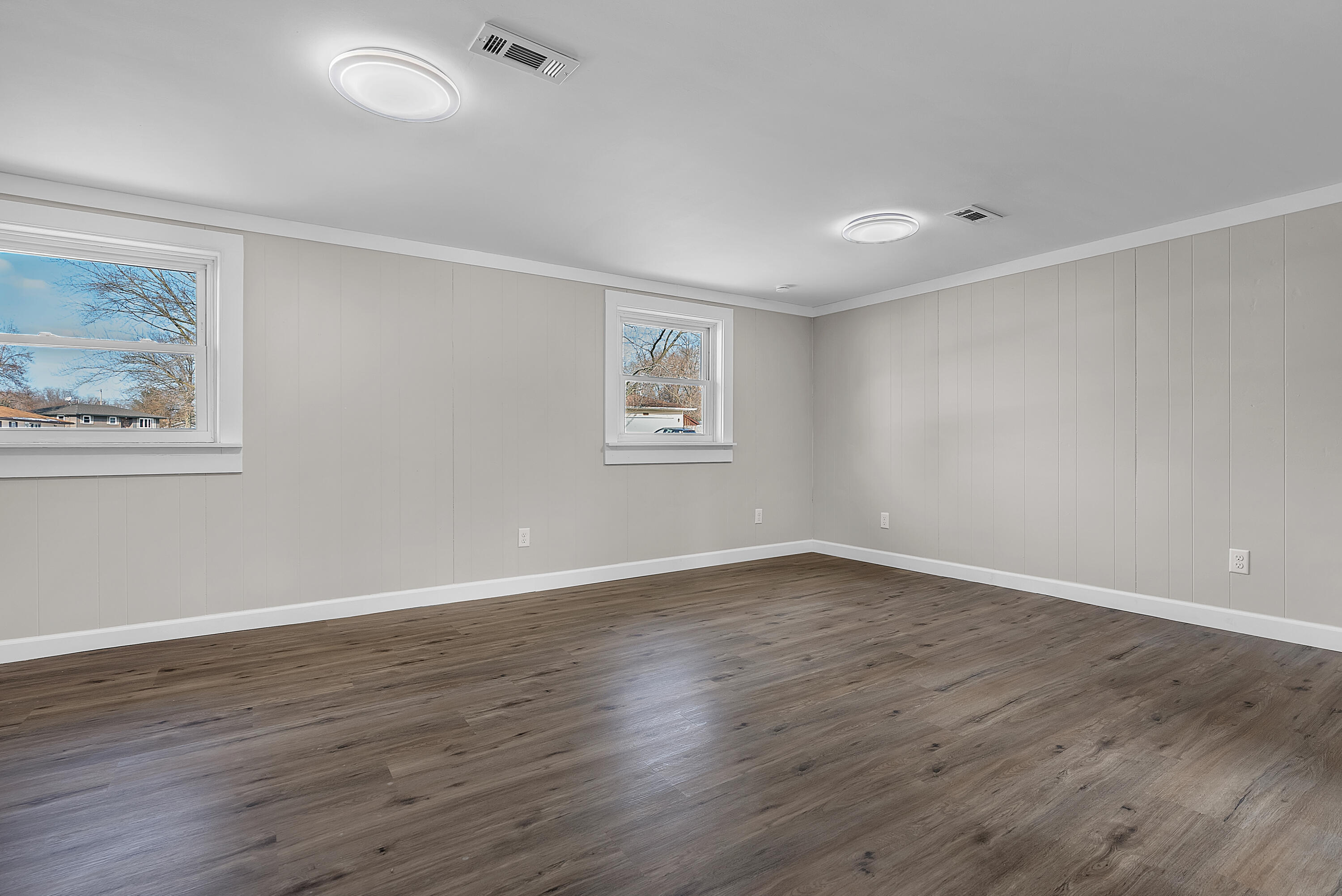 6395 Valleyview Avenue Portage, IN 46368 - Photo 16 of 20 an empty room with wooden floor and windows