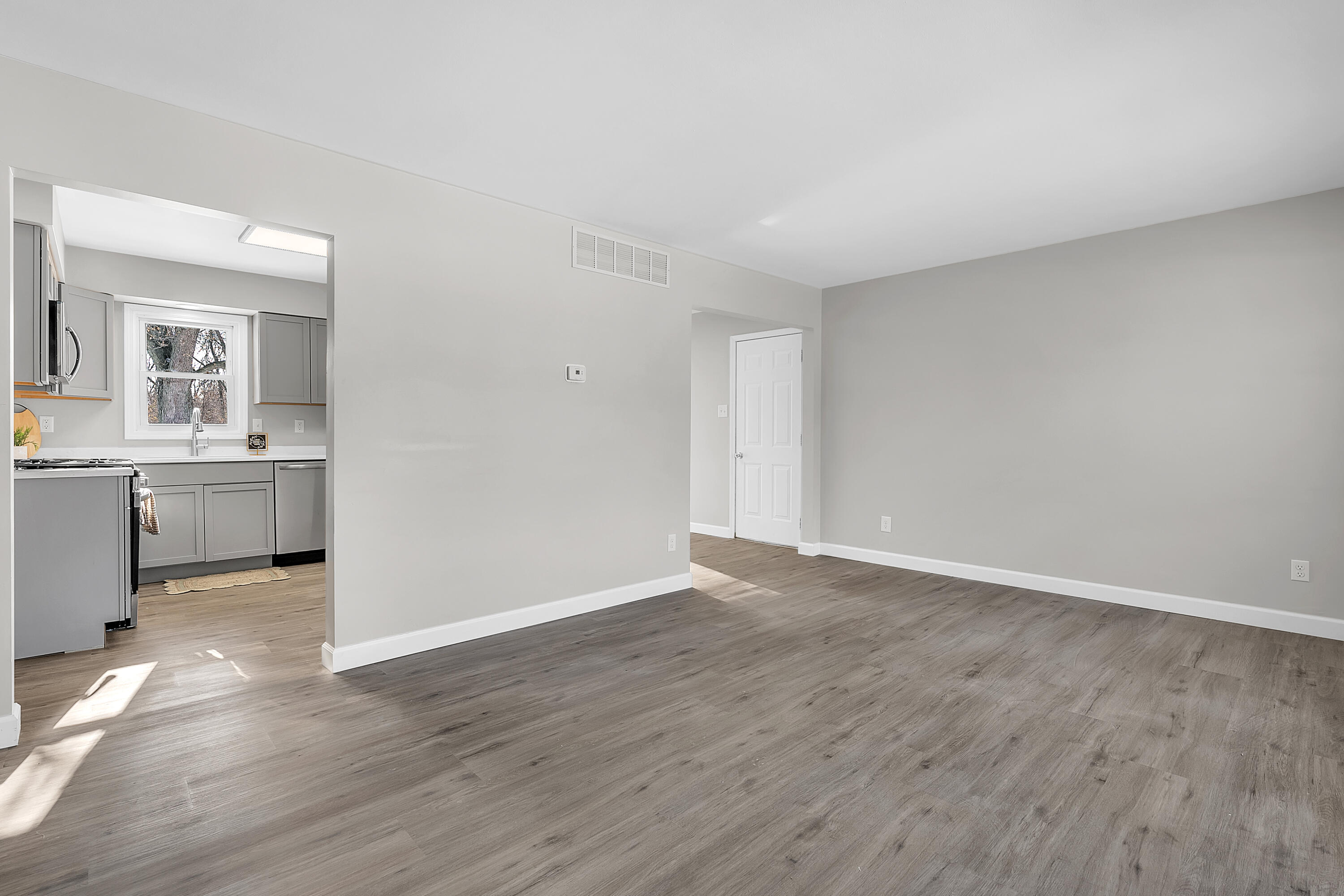 6395 Valleyview Avenue Portage, IN 46368 - Photo 5 of 20 a view of a kitchen with wooden floor and a sink